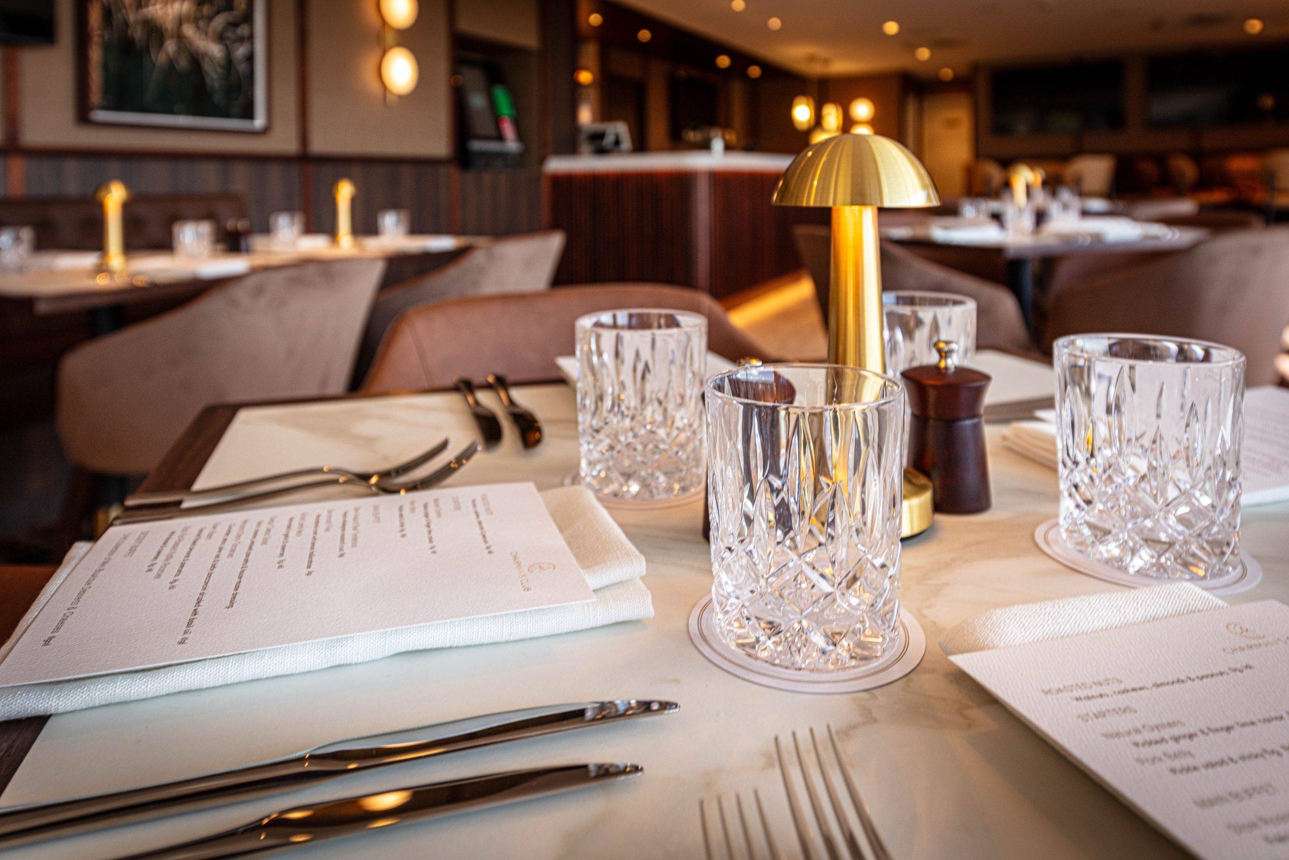 Sunshine Coast Turf Club Chairman's Club dining and hospitality area. Modern furnishings with luxurious table layouts.