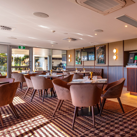 Sunshine Coast Turf Club Chairman's Club dining and hospitality area. Modern furnishings with luxurious table layouts.