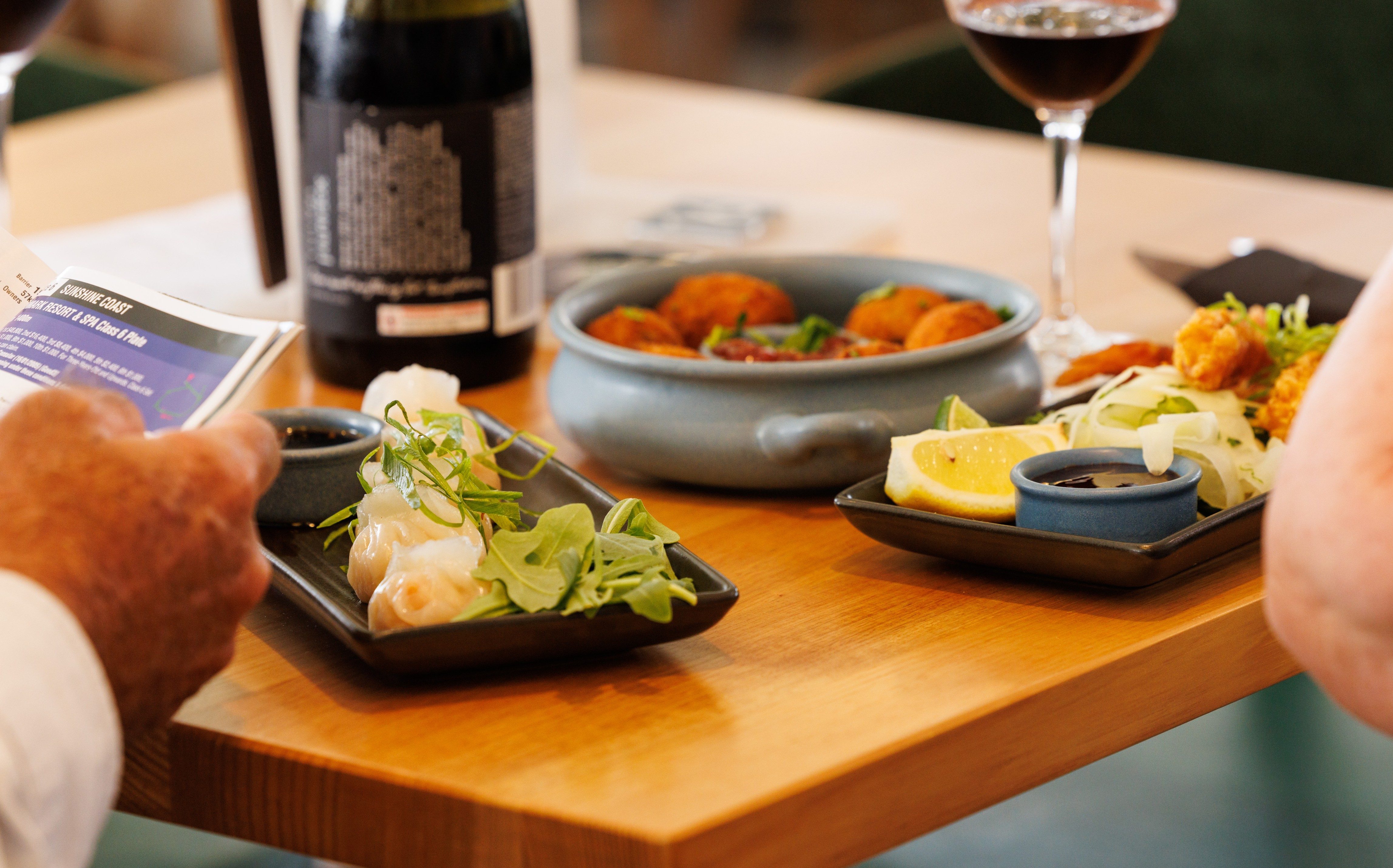 Sunshine Coast Turf Club Chairman's Club dining and hospitality area. Modern furnishings with luxurious table layouts.